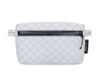 White quilted bag with a black zipper on a white background