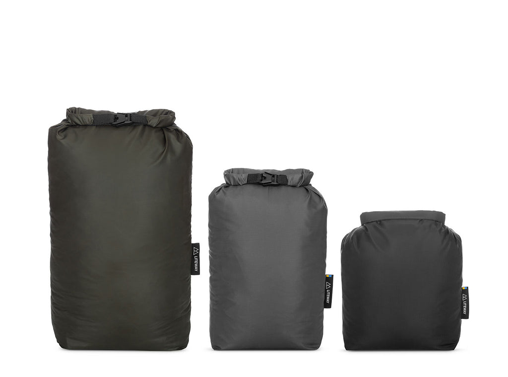 Three sizes of black dry bags on a white background