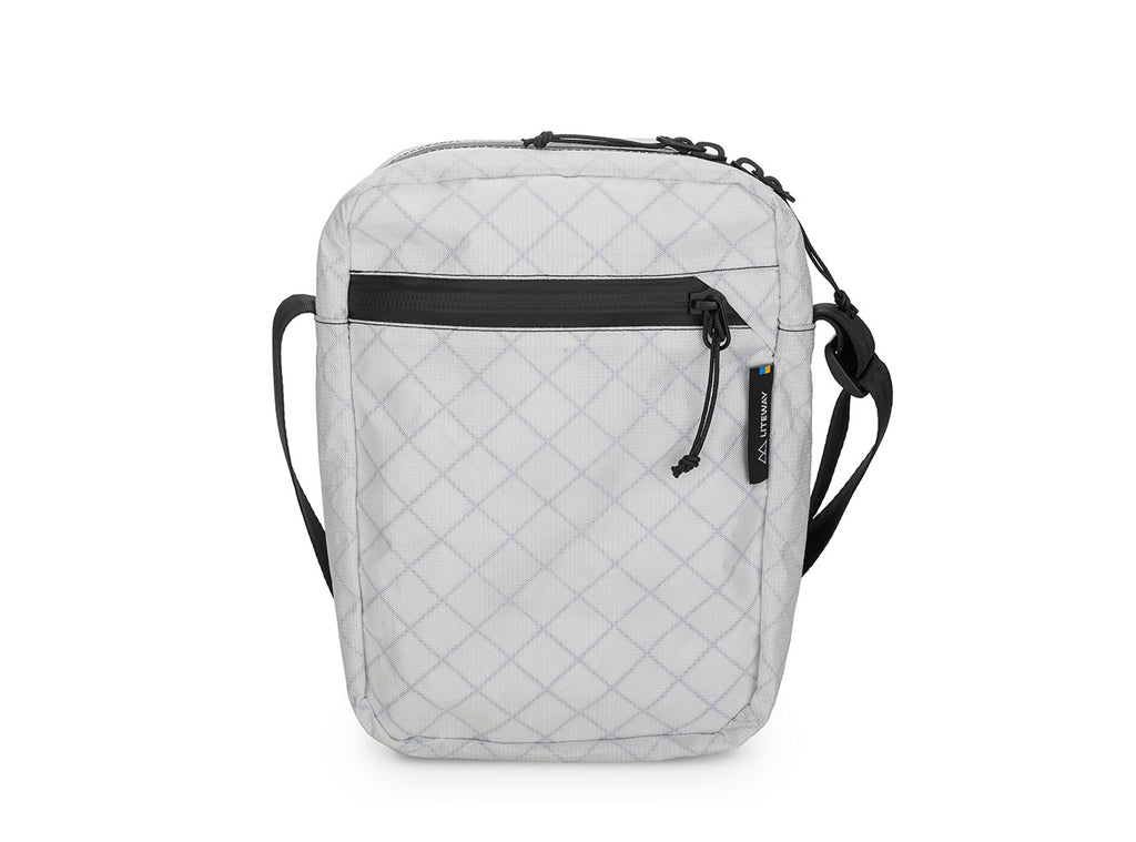 Quilted gray crossbody bag with black accents on a white background