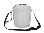 Quilted gray crossbody bag on a white background