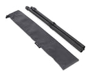 Black tripod and carrying bag on a beige background