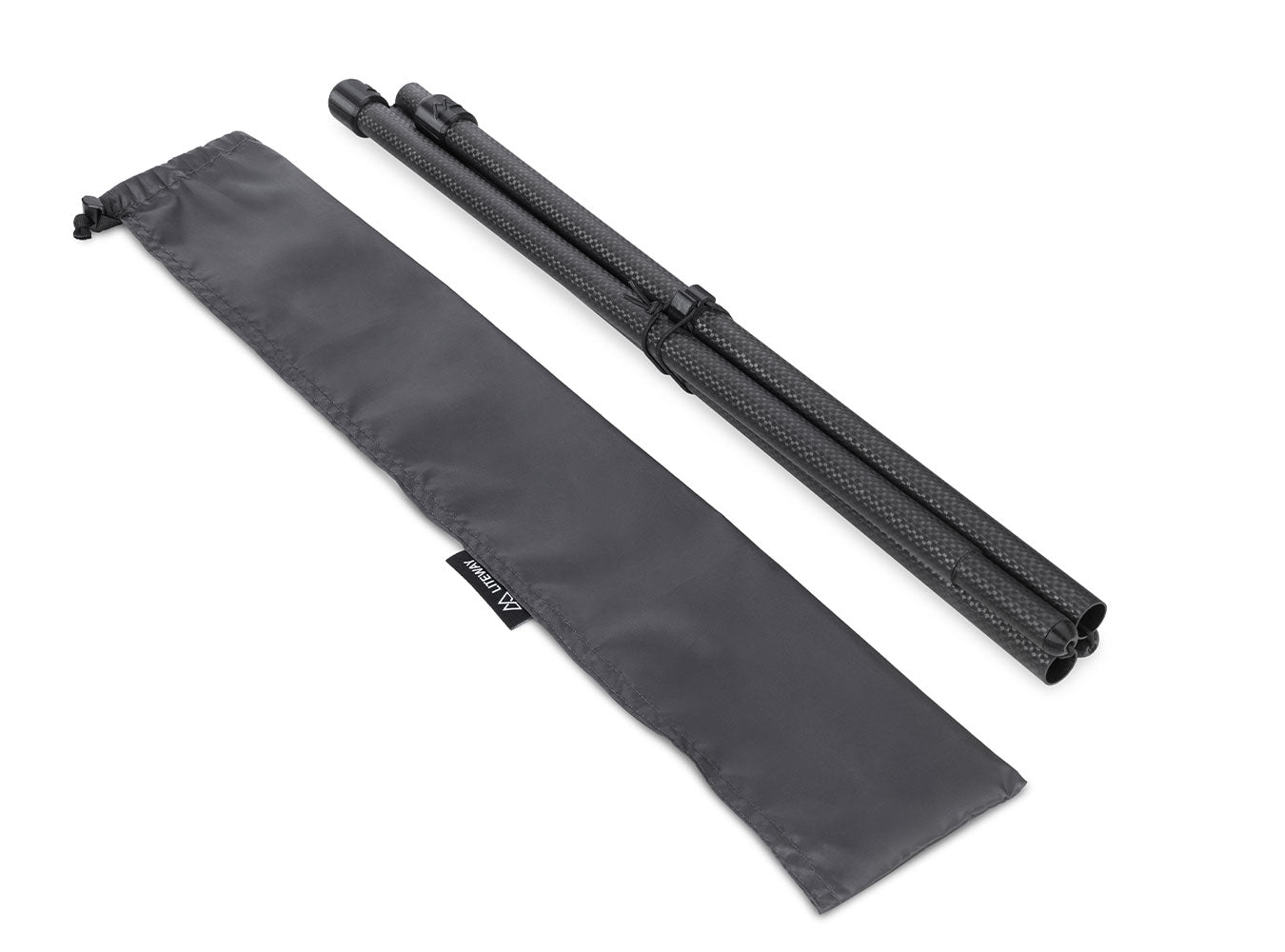 Black tripod and carrying bag on a beige background
